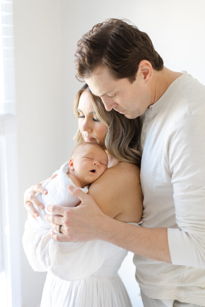 Newborn photoshoot with mother and father